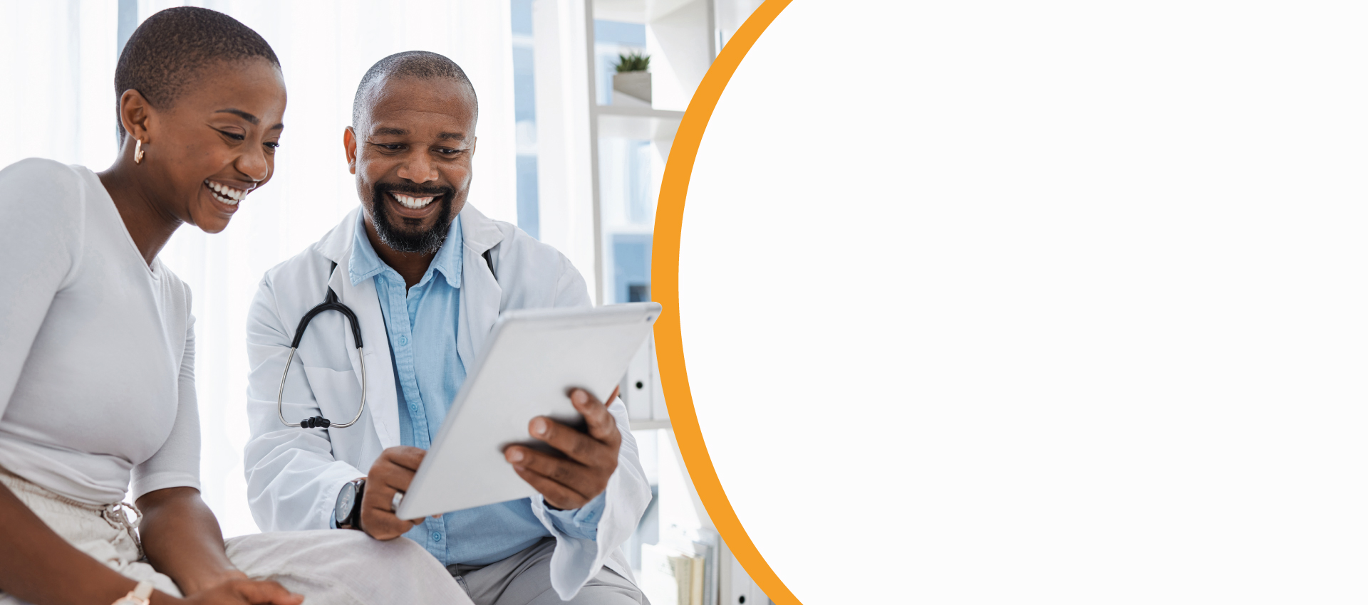Doctor and patient reviewing a tablet together